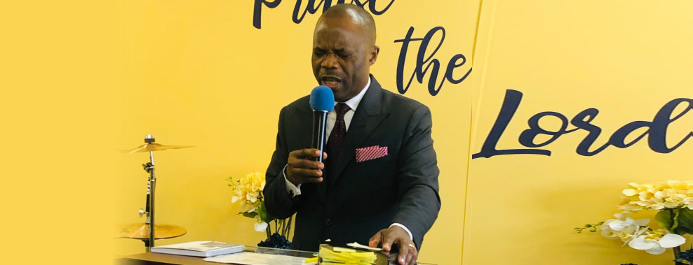a pastor holding a microphone